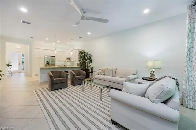 a living room with furniture and a table