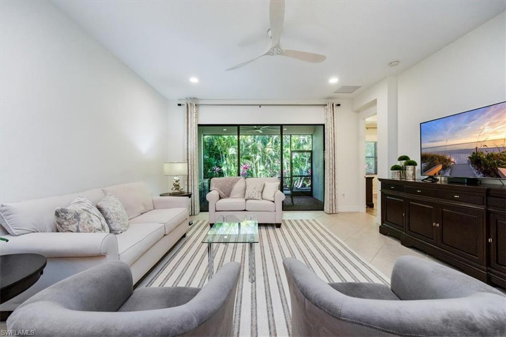 13459 Sumter Lane Naples, FL 34109 - Photo 6 of 33 a living room with furniture and a large window
