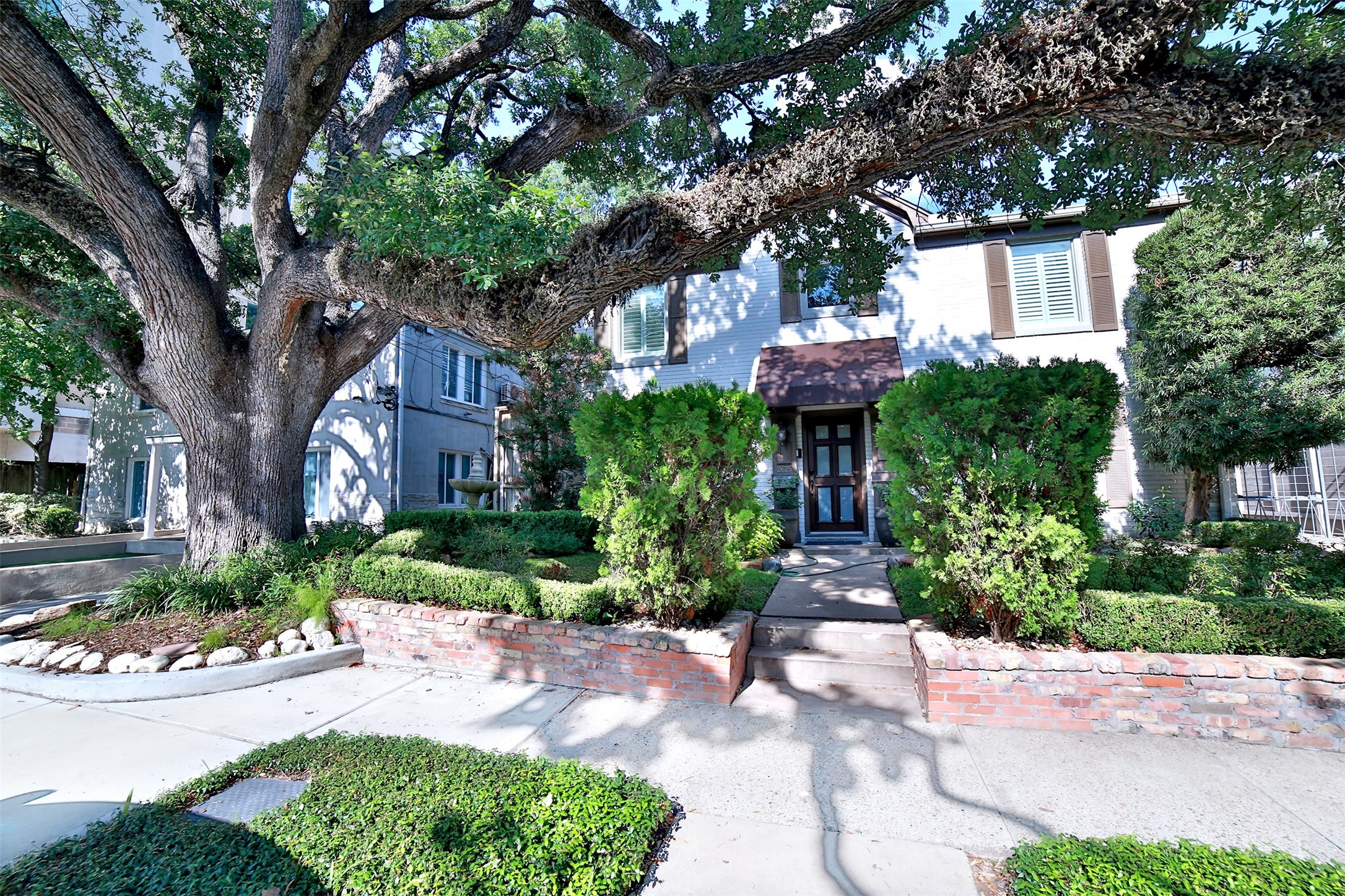 2625 Peckham Street Houston, TX 77098 - Photo 1 of 27 a front view of a house with garden