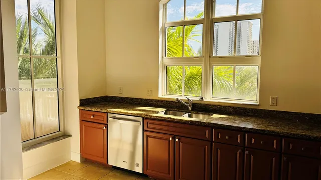 a kitchen with a sink and a window