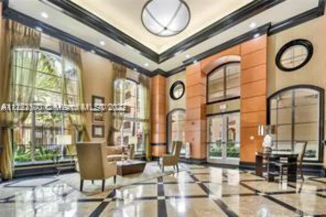 a view of a entryway door of the building and outdoor seating