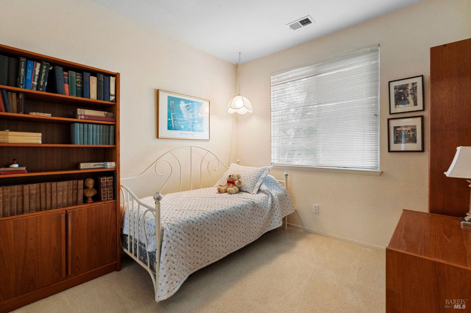 672 Meadowbrook Lane Rio Vista, CA 94571 - Photo 16 of 39 a bedroom with a bed and a book shelf