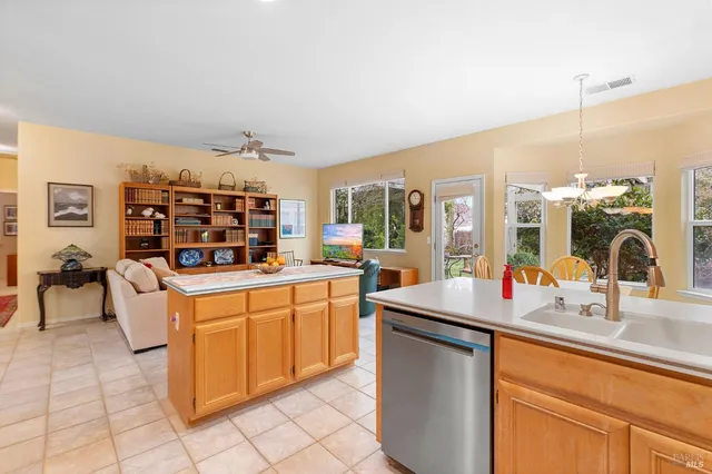 a kitchen with stainless steel appliances granite countertop a sink and cabinets