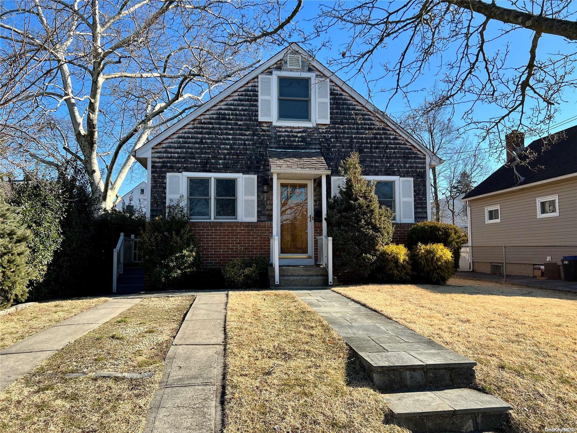 24 Edgewood Road Port Washington, NY 11050 - Photo 1 of 1 a front view of a house with a yard