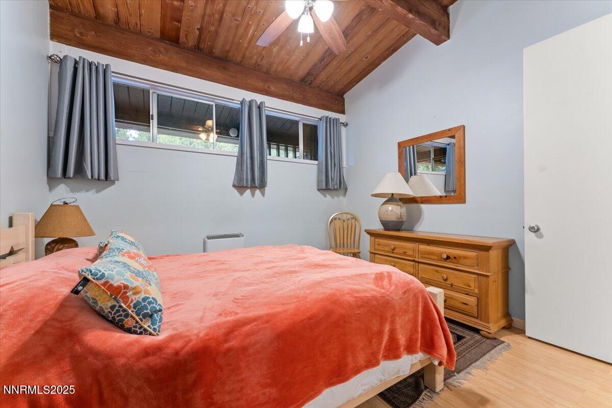 751 Tahoe Boulevard, Unit 21 Incline Village, NV 89451 - Photo 11 of 23 a bed sitting in a bedroom next to a window