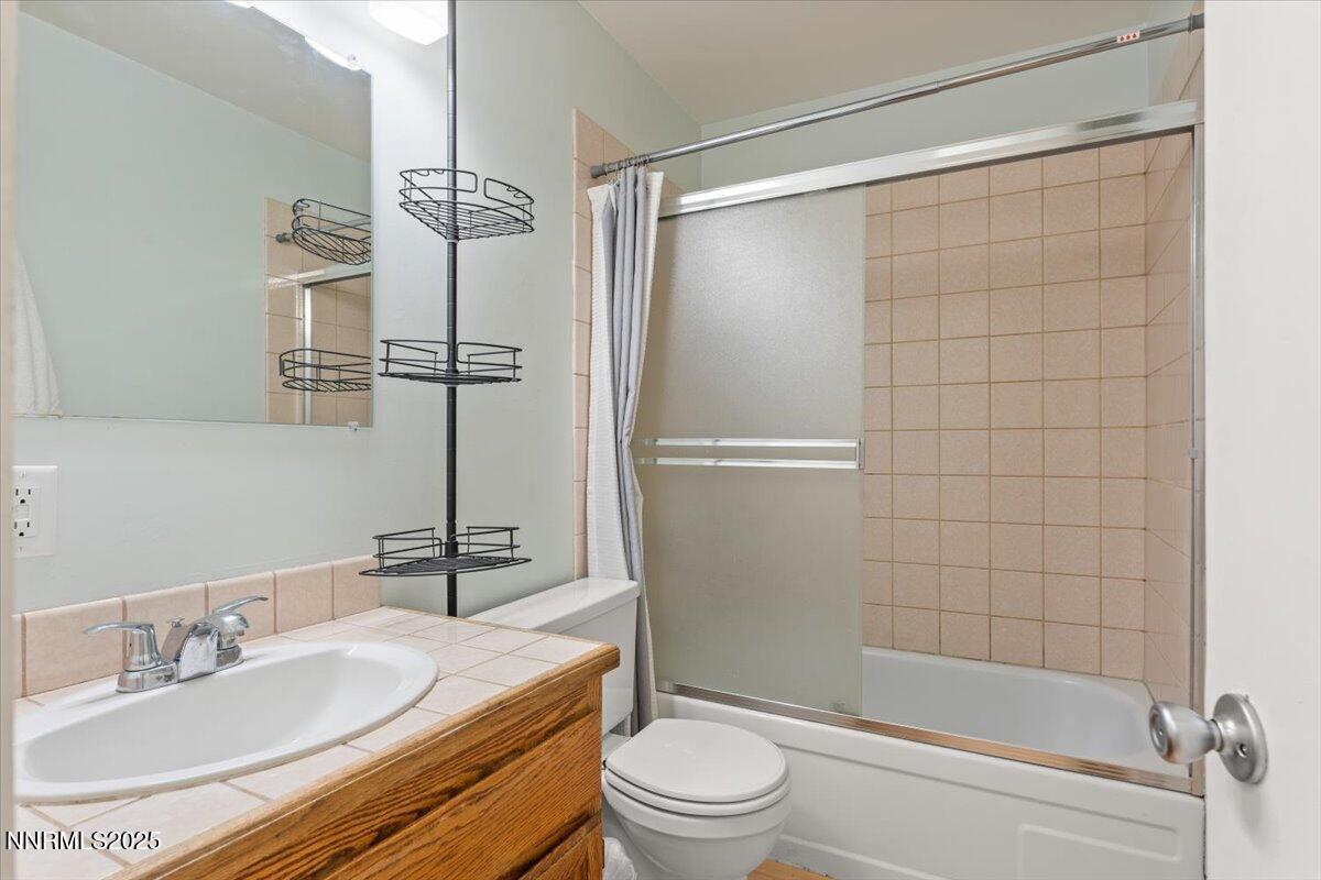 751 Tahoe Boulevard, Unit 21 Incline Village, NV 89451 - Photo 12 of 23 a bathroom with a sink a toilet and shower