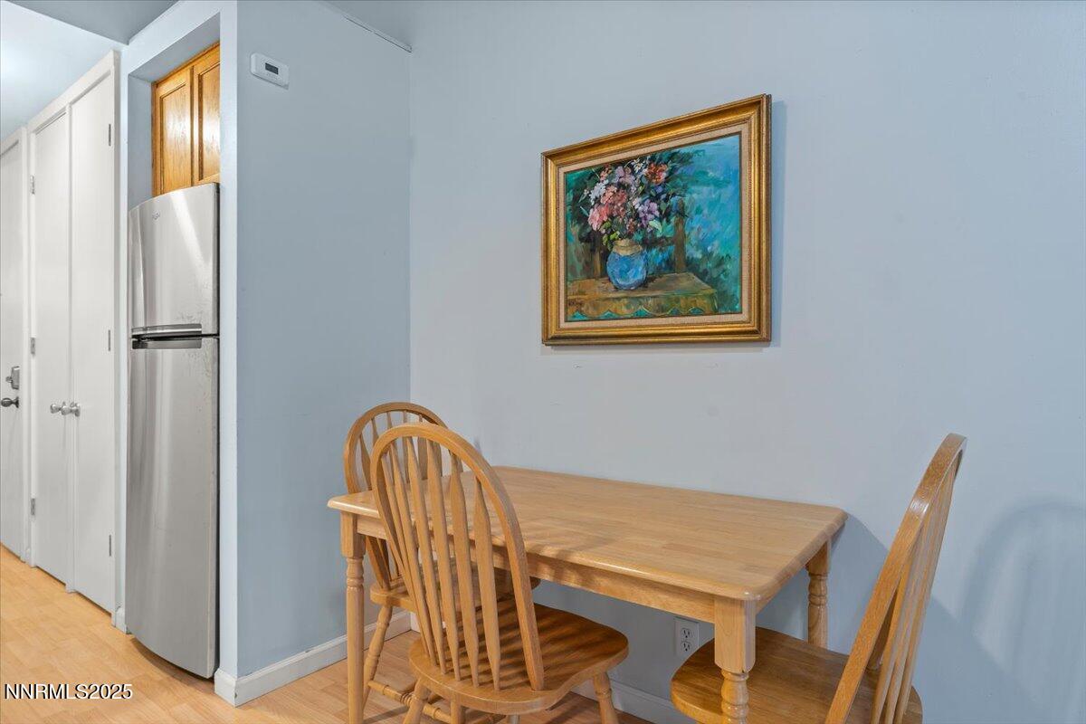 751 Tahoe Boulevard, Unit 21 Incline Village, NV 89451 - Photo 8 of 23 a view of a dining room with furniture and a window