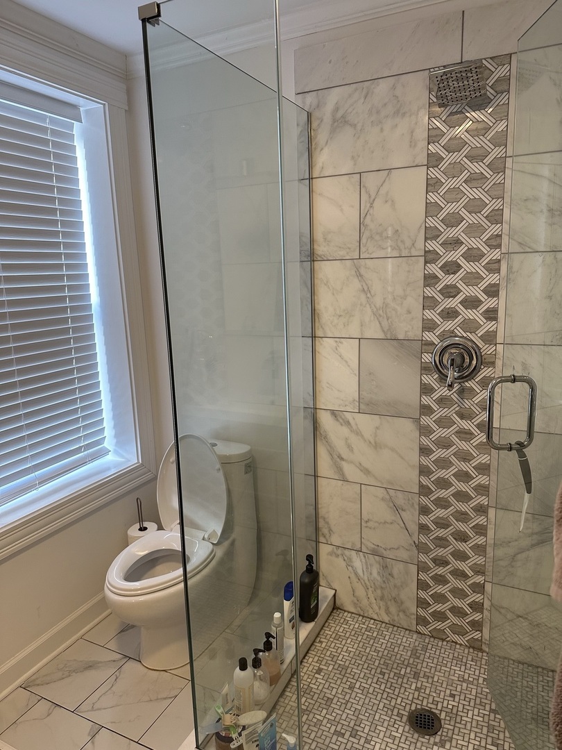 2138 West Shakespeare Avenue, Unit 1 Chicago, IL 60647 - Photo 12 of 14 a bathroom with a sink and a mirror