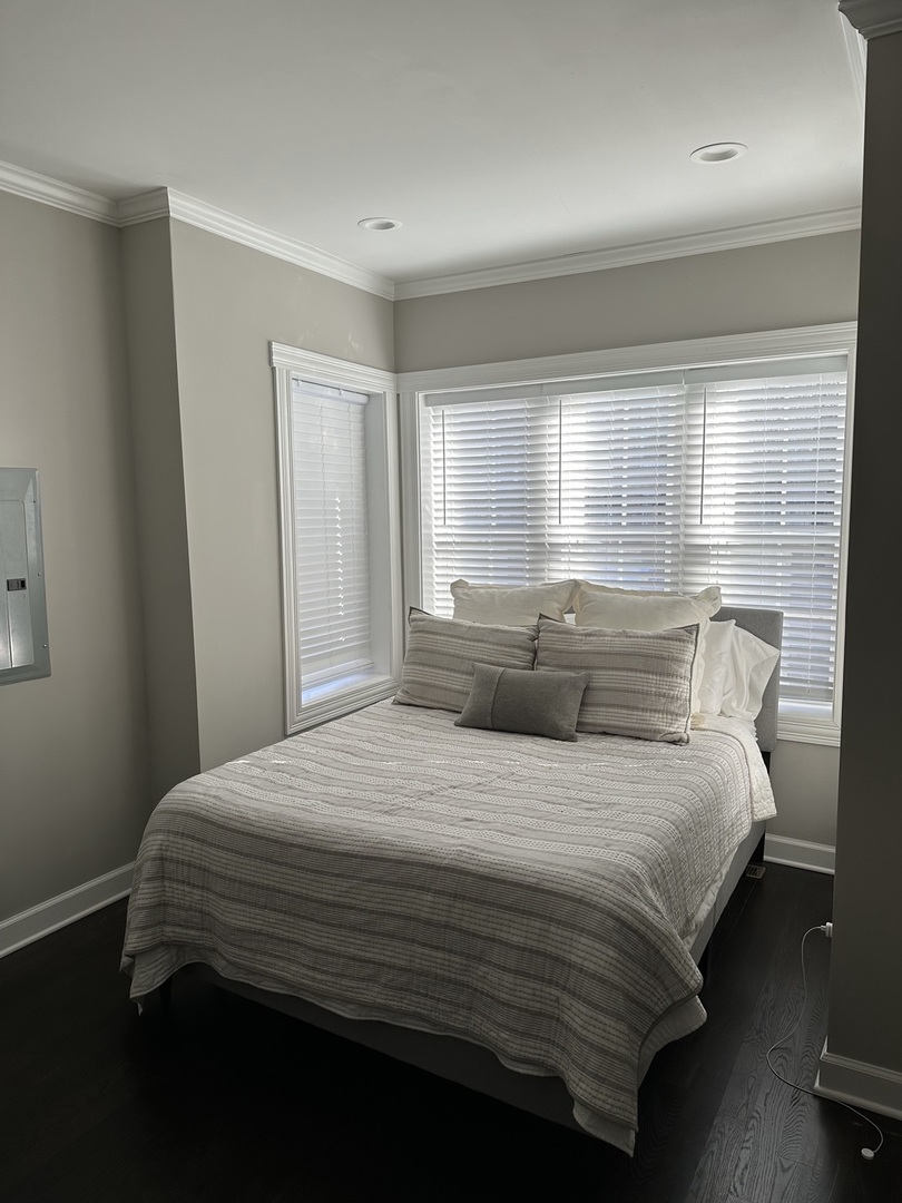 2138 West Shakespeare Avenue, Unit 1 Chicago, IL 60647 - Photo 13 of 14 a bedroom with a bed and window