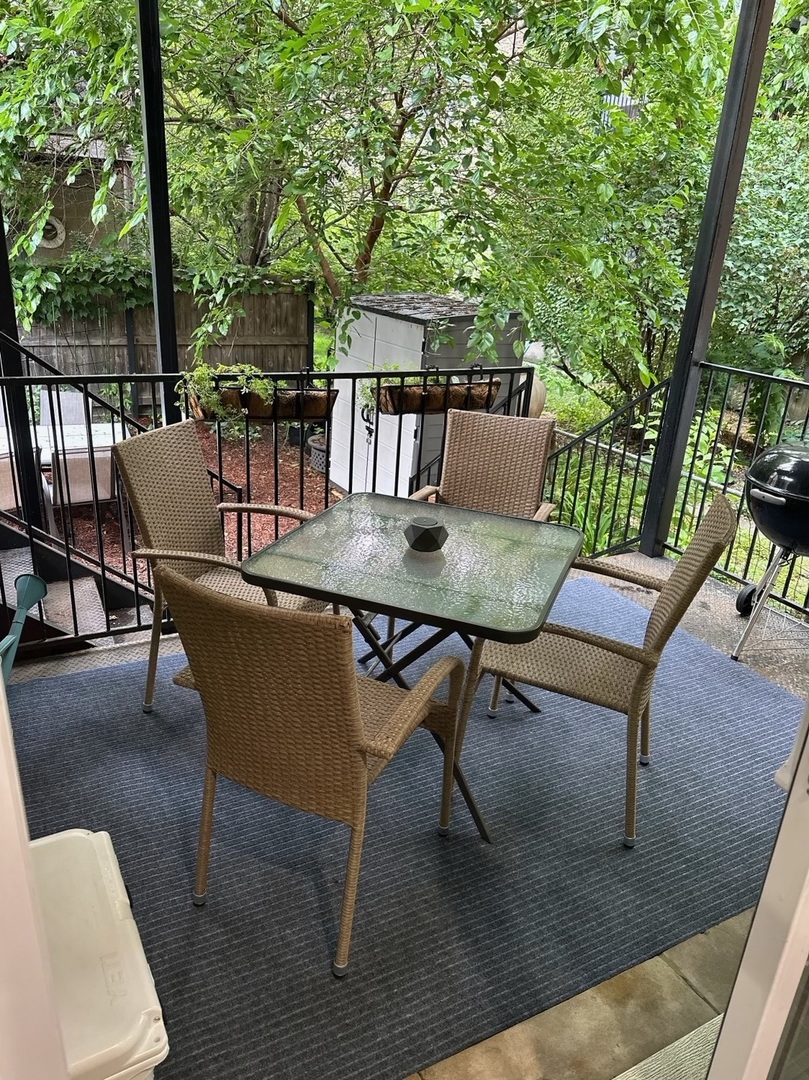 2138 West Shakespeare Avenue, Unit 1 Chicago, IL 60647 - Photo 14 of 14 a backyard of a house with table and chairs