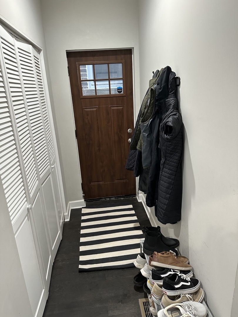 2138 West Shakespeare Avenue, Unit 1 Chicago, IL 60647 - Photo 2 of 14 a bedroom with a bed and a window