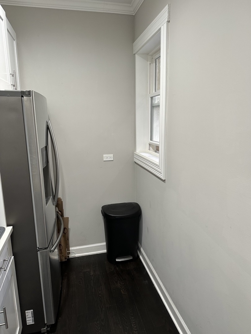 2138 West Shakespeare Avenue, Unit 1 Chicago, IL 60647 - Photo 6 of 14 a view of a workspace with furniture and a window
