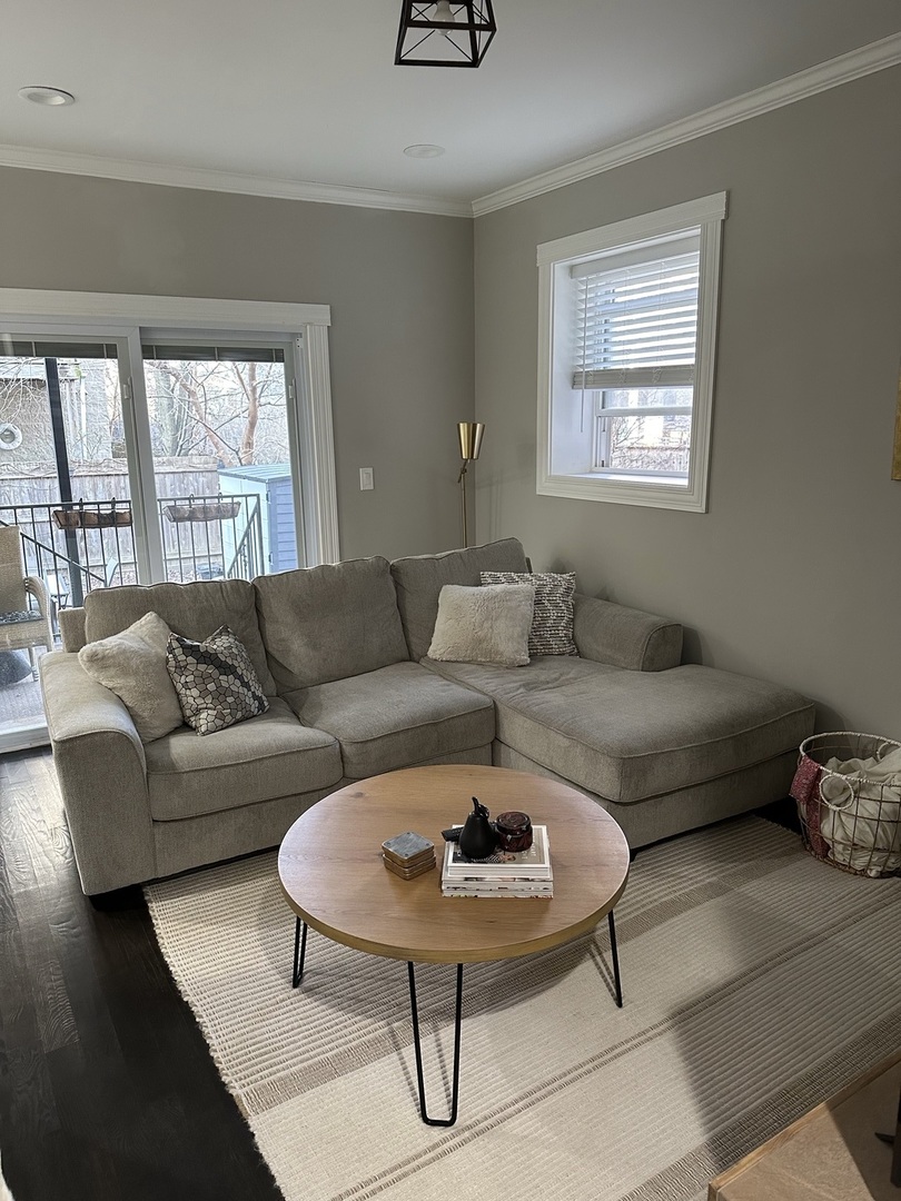 2138 West Shakespeare Avenue, Unit 1 Chicago, IL 60647 - Photo 7 of 14 a living room with furniture and a window