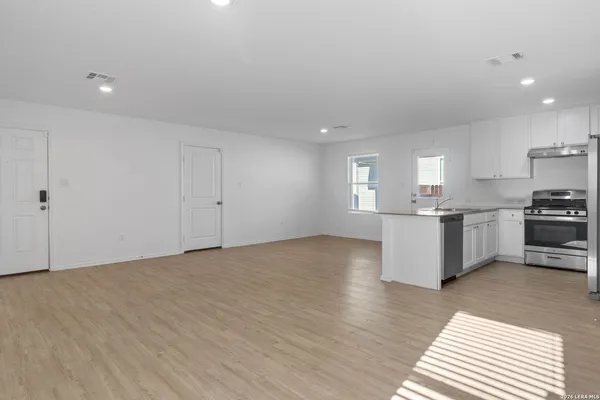 a view of kitchen with wooden floor