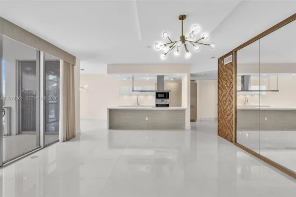 a view of a kitchen with cabinet and a ceiling fan