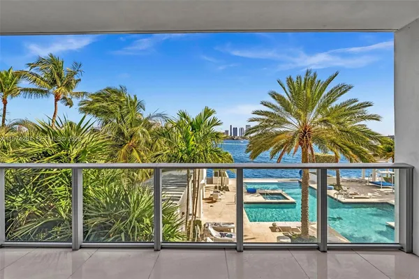 a view of a entryway door with potted plants