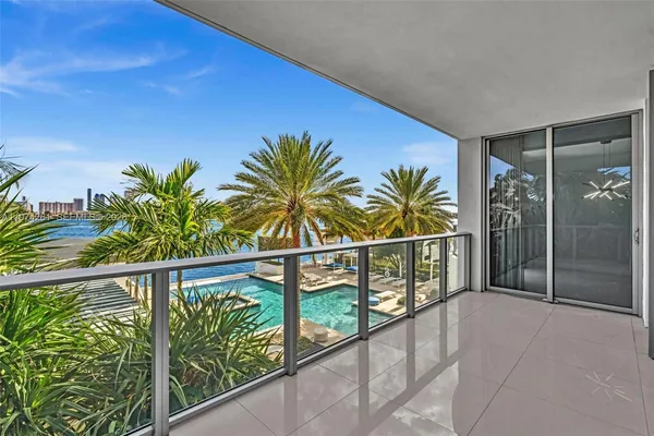 a view of a palm tree with lounge chair