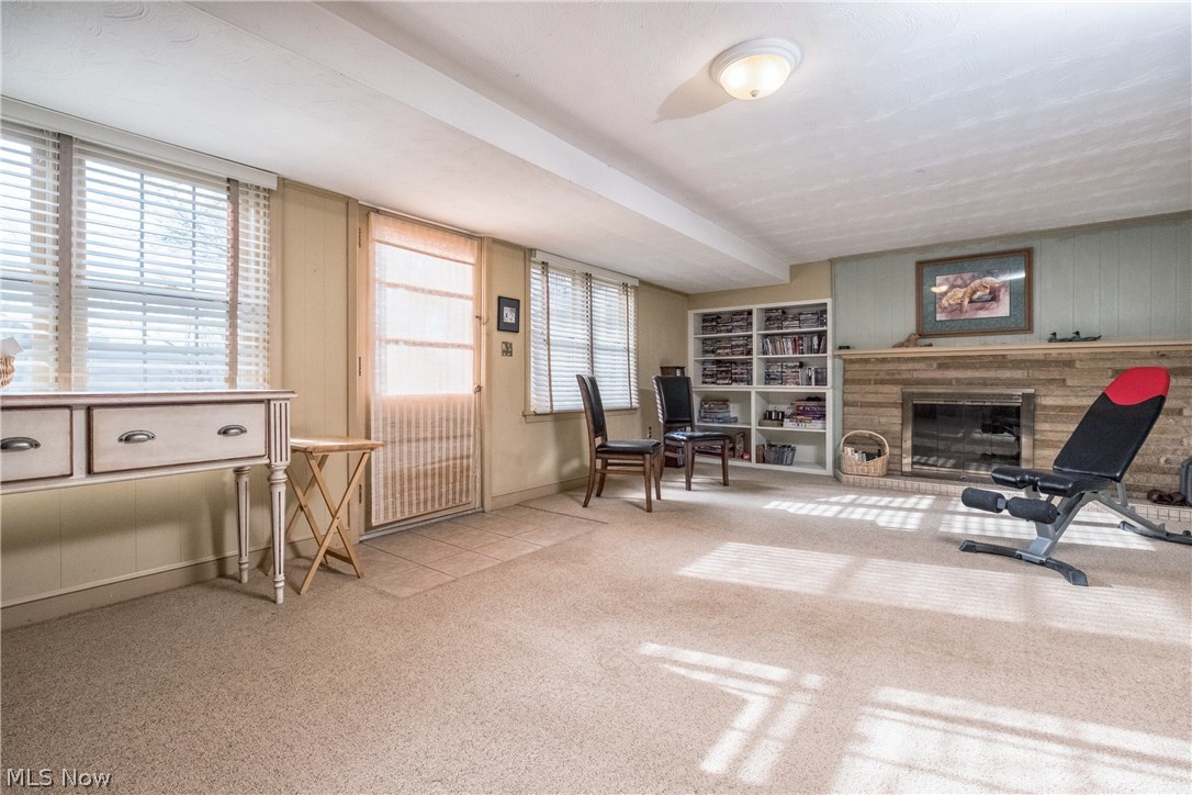2815 Westdale Road Northwest Canton, OH 44708 - Photo 29 of 33 The lower level family room features a great entertaining space and gas log fireplace and walks out to the back patio.