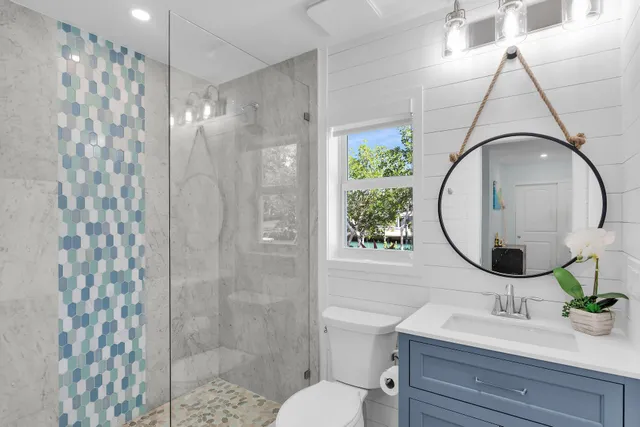 a bedroom with a bed and a view of kitchen