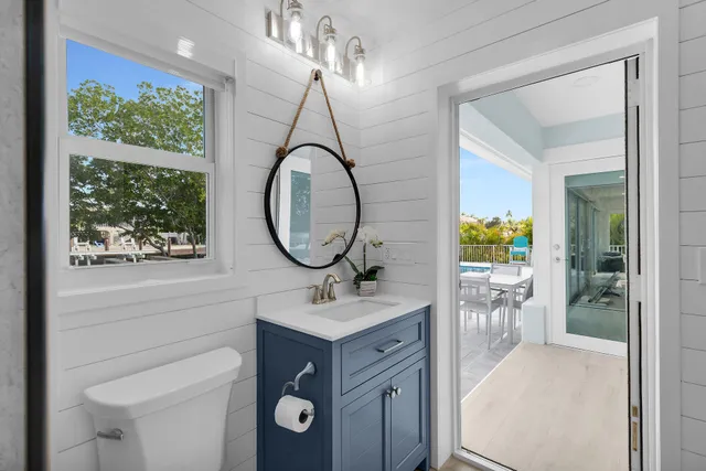 a bedroom with a bed and a book shelf