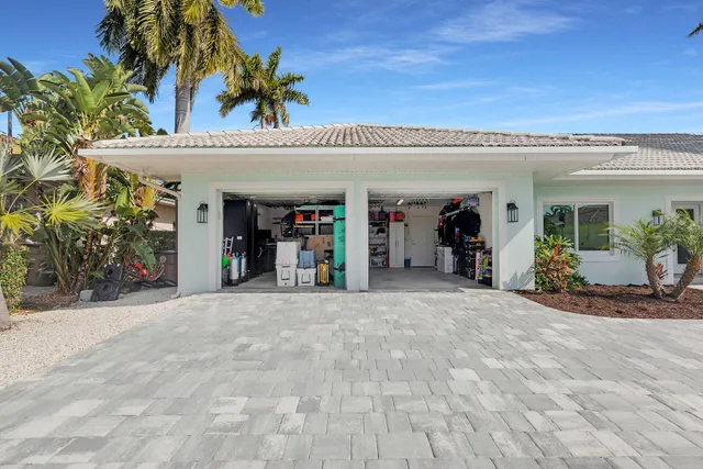 an aerial view of ocean with residential house with outdoor space