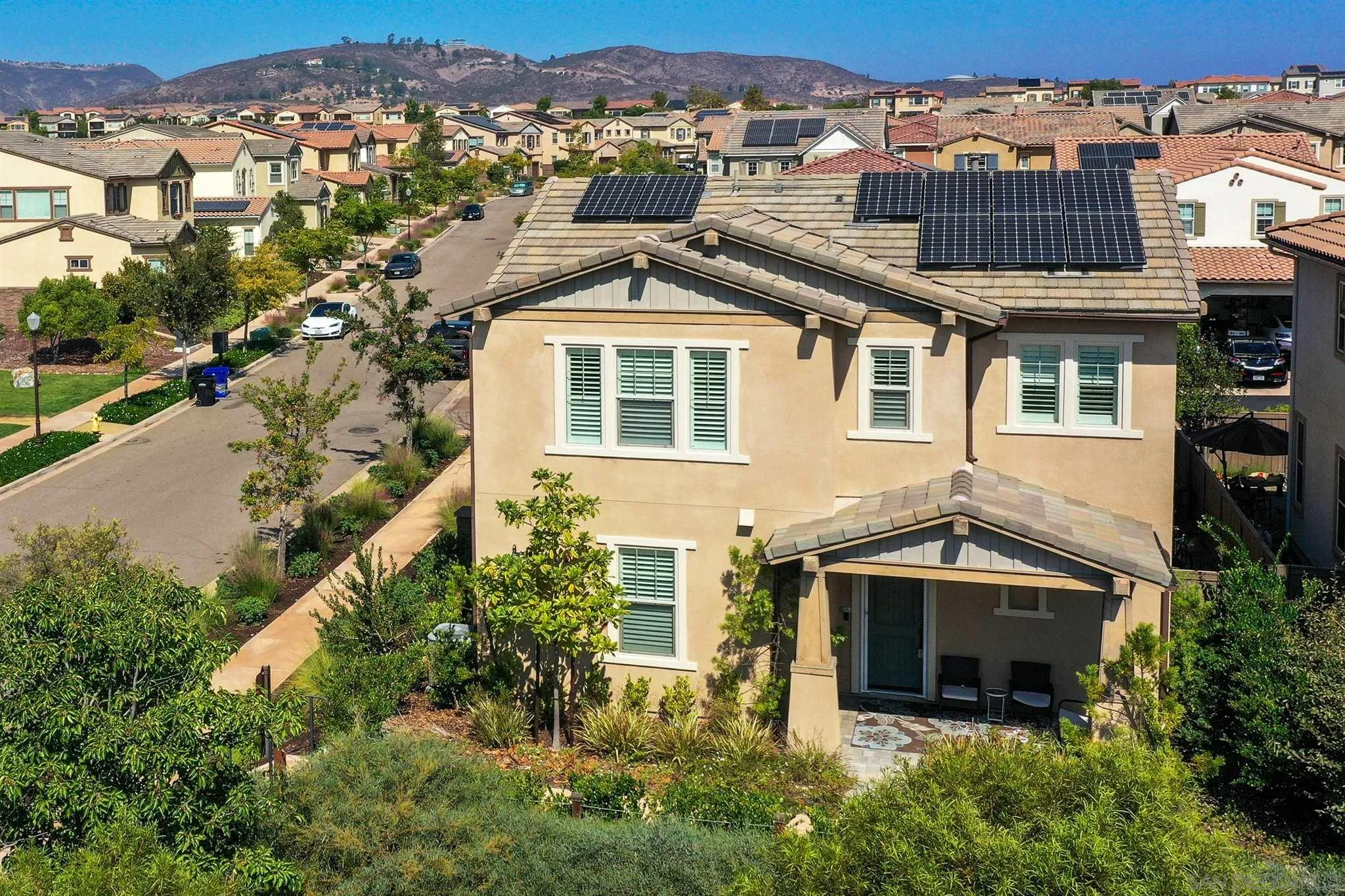 15555 Tanner Ridge Road San Diego, CA 92127 - Photo 54 of 57 a front view of a house with a yard