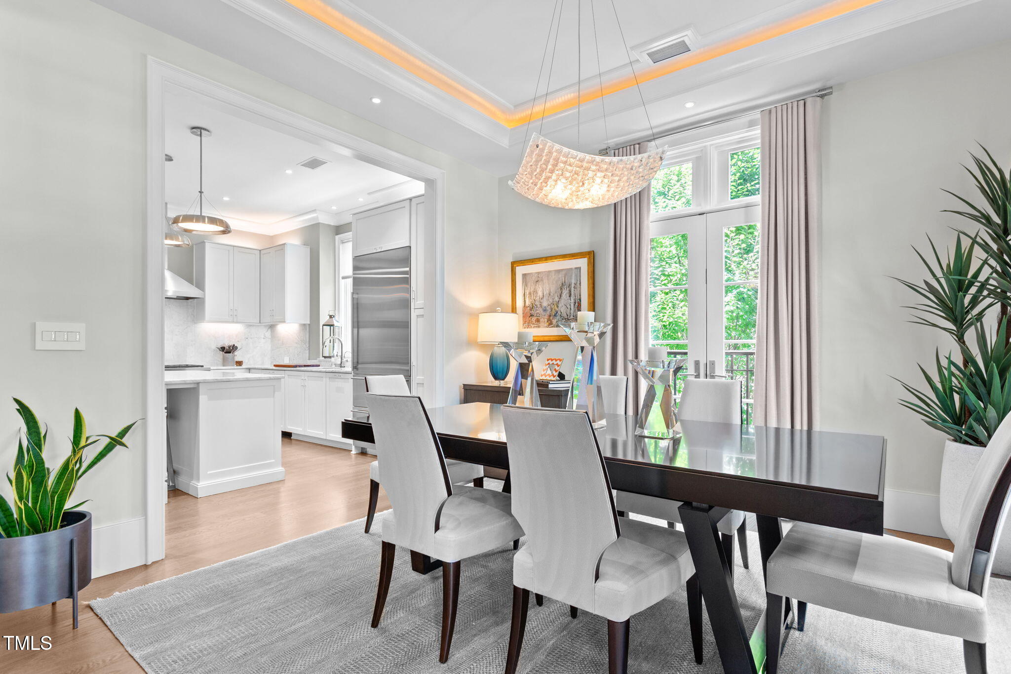 2015 Fairview Road, Unit 200 Raleigh, NC 27608 - Photo 14 of 58 a view of a dining room with furniture and a potted plant