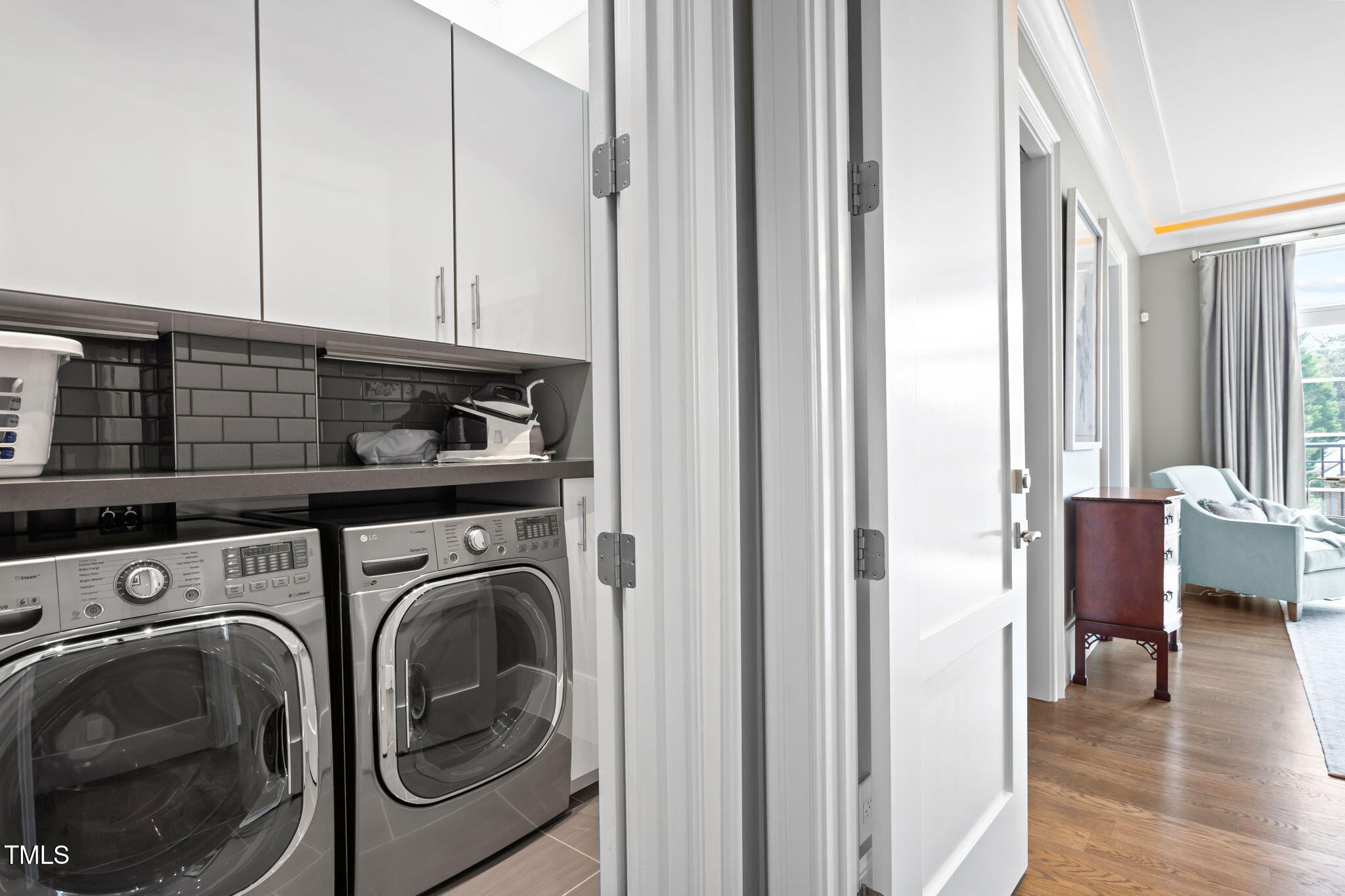 2015 Fairview Road, Unit 200 Raleigh, NC 27608 - Photo 33 of 58 a view of a hallway with washer and dryer