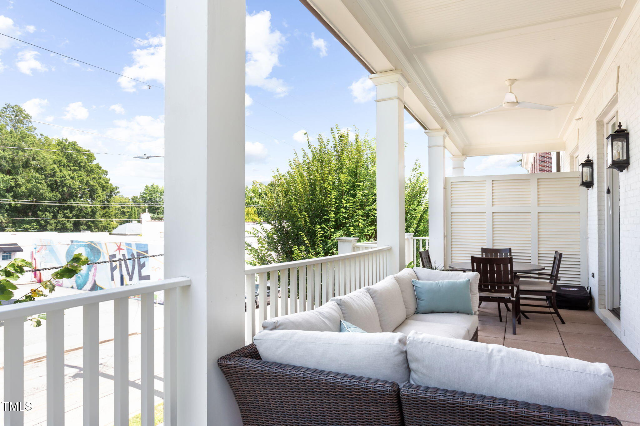 2015 Fairview Road, Unit 200 Raleigh, NC 27608 - Photo 34 of 58 a balcony with furniture and a book shelf
