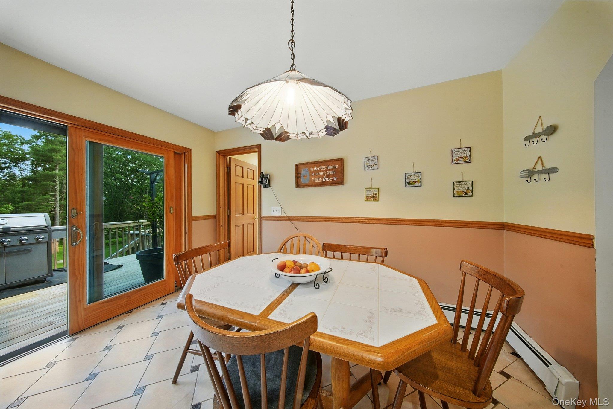 193 Dill Road Forestburgh, NY 12777 - Photo 14 of 31 Dining area with a baseboard heating unit and a chandelier