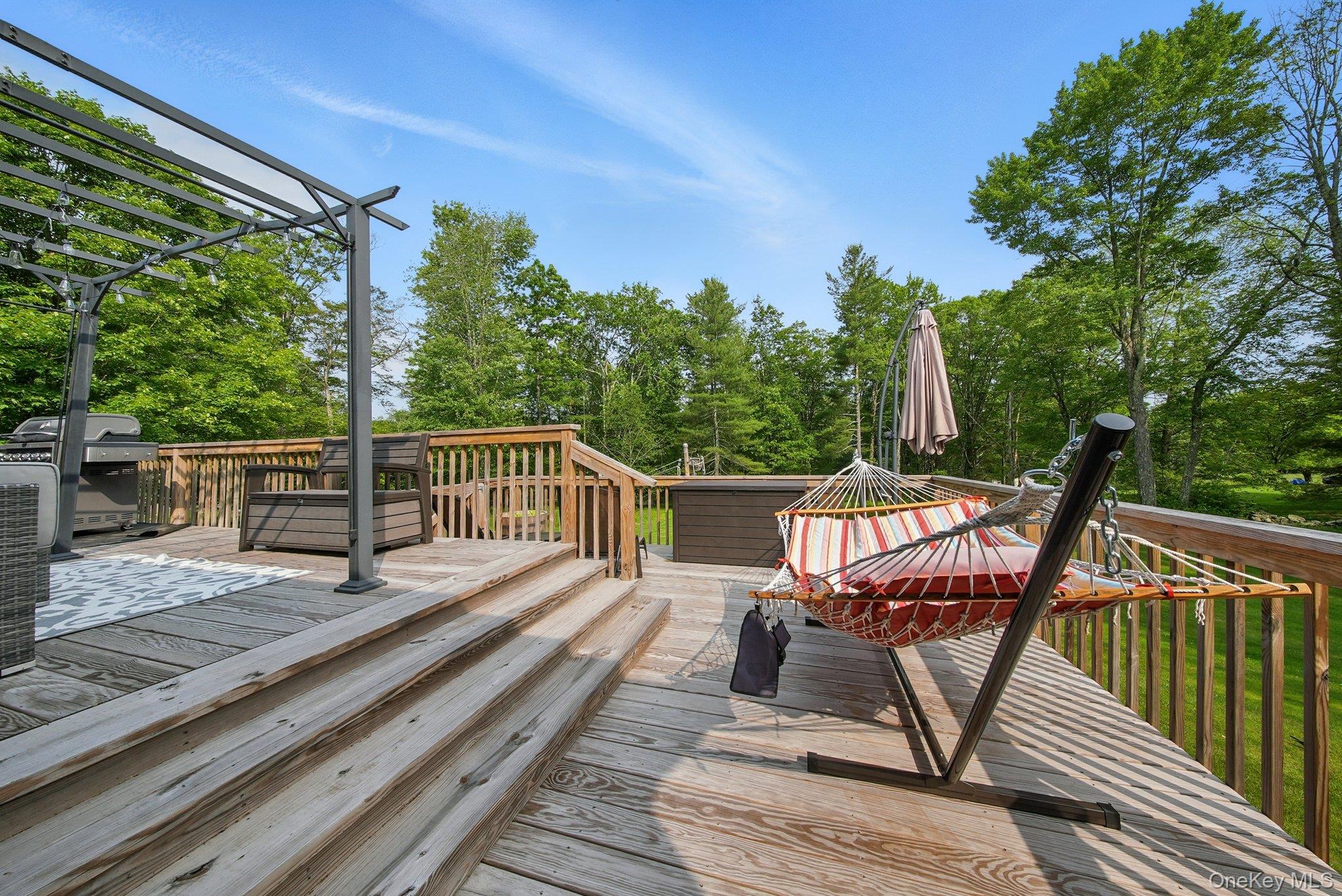 193 Dill Road Forestburgh, NY 12777 - Photo 24 of 31 Deck featuring view of wooded area, grilling area, and a pergola