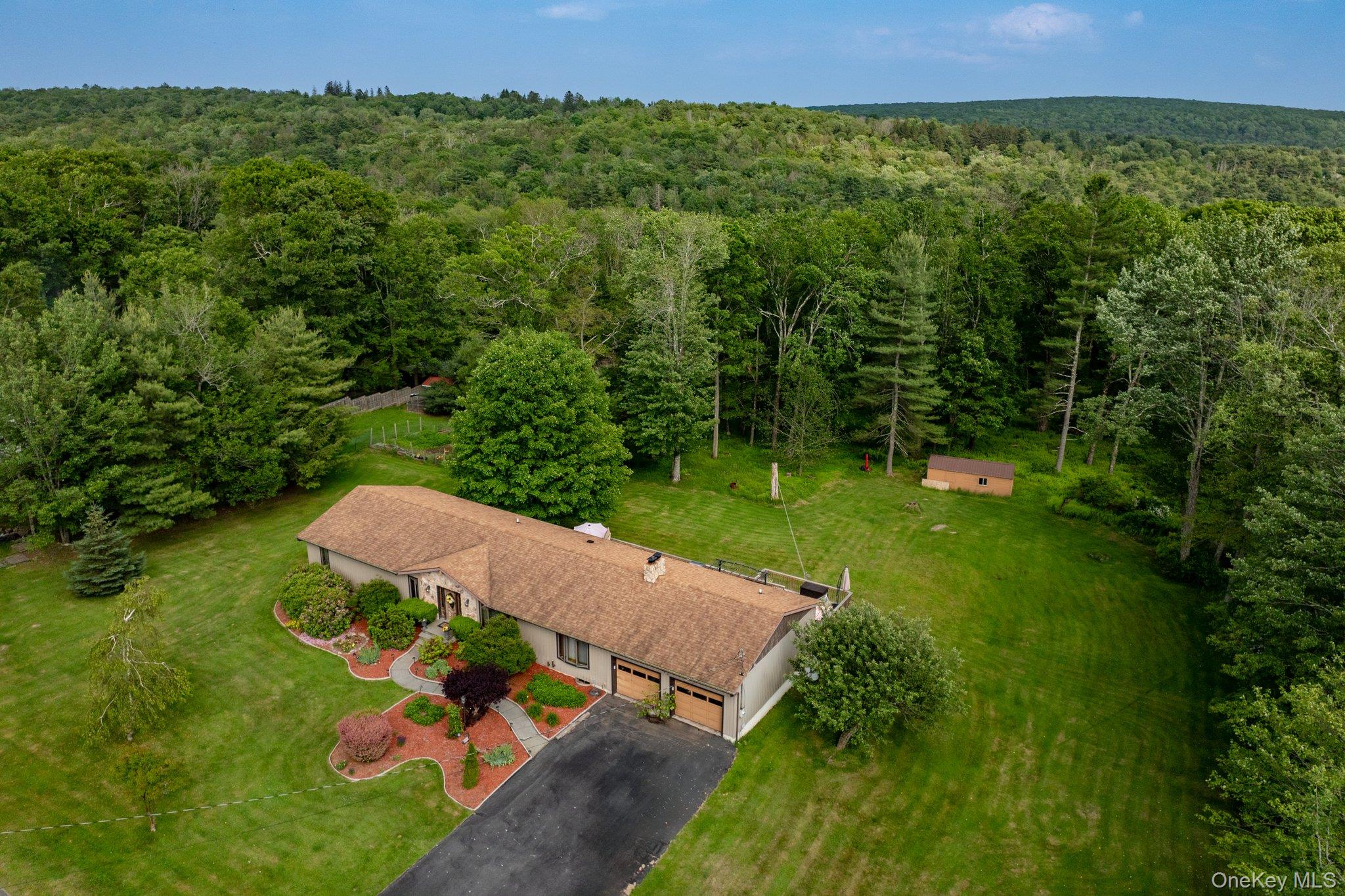 193 Dill Road Forestburgh, NY 12777 - Photo 30 of 31 Aerial view of property and surrounding area featuring a heavily wooded area