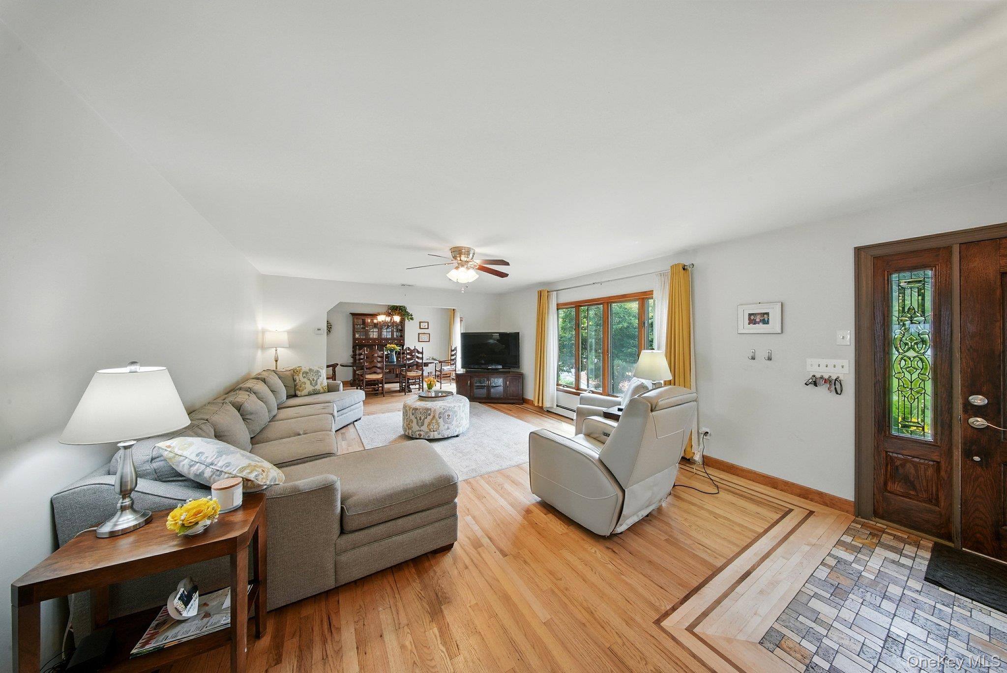 193 Dill Road Forestburgh, NY 12777 - Photo 6 of 31 Living room with light wood-style floors and ceiling fan