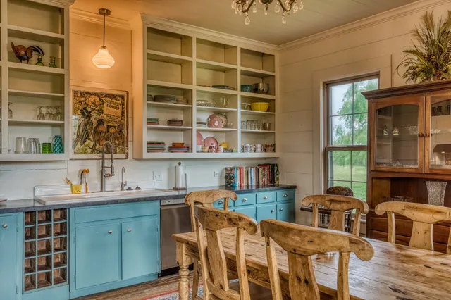 a dining room with a table and chairs