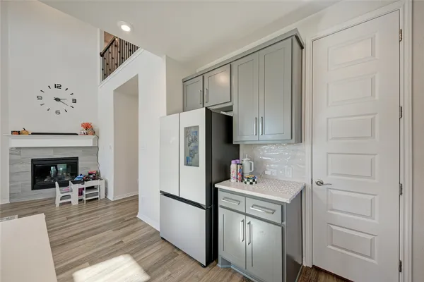 a kitchen with stainless steel appliances granite countertop white cabinets and white appliances