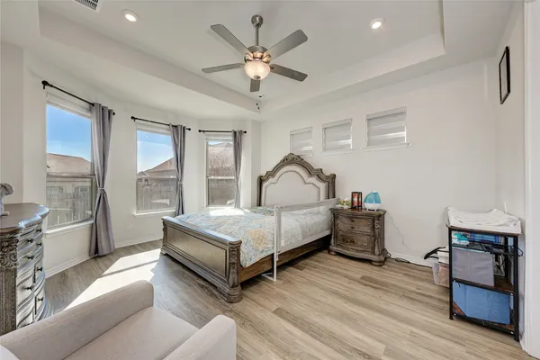 a kitchen with a refrigerator sink and cabinets