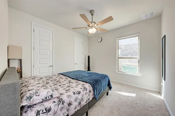 a bedroom with a bed and furniture
