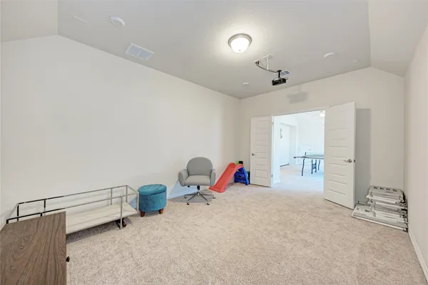 a room with windows and ceiling fan