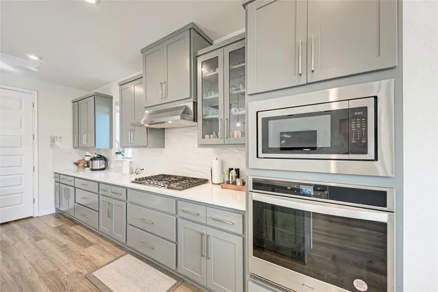a living room with furniture a fireplace and a table