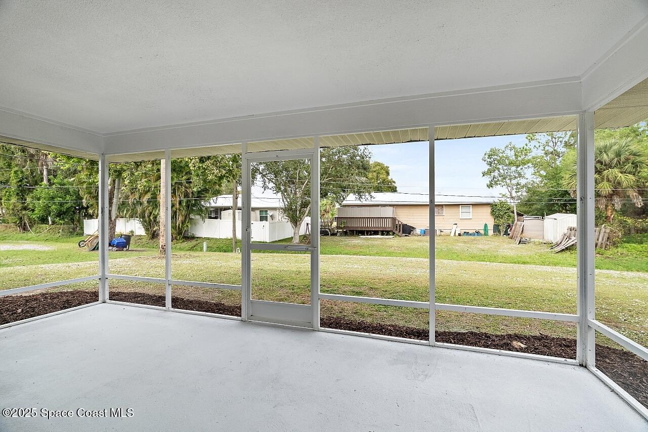 914 Devon Avenue Sebastian, FL 32958 - Photo 20 of 40 a view of a big room with floor to ceiling windows and city view