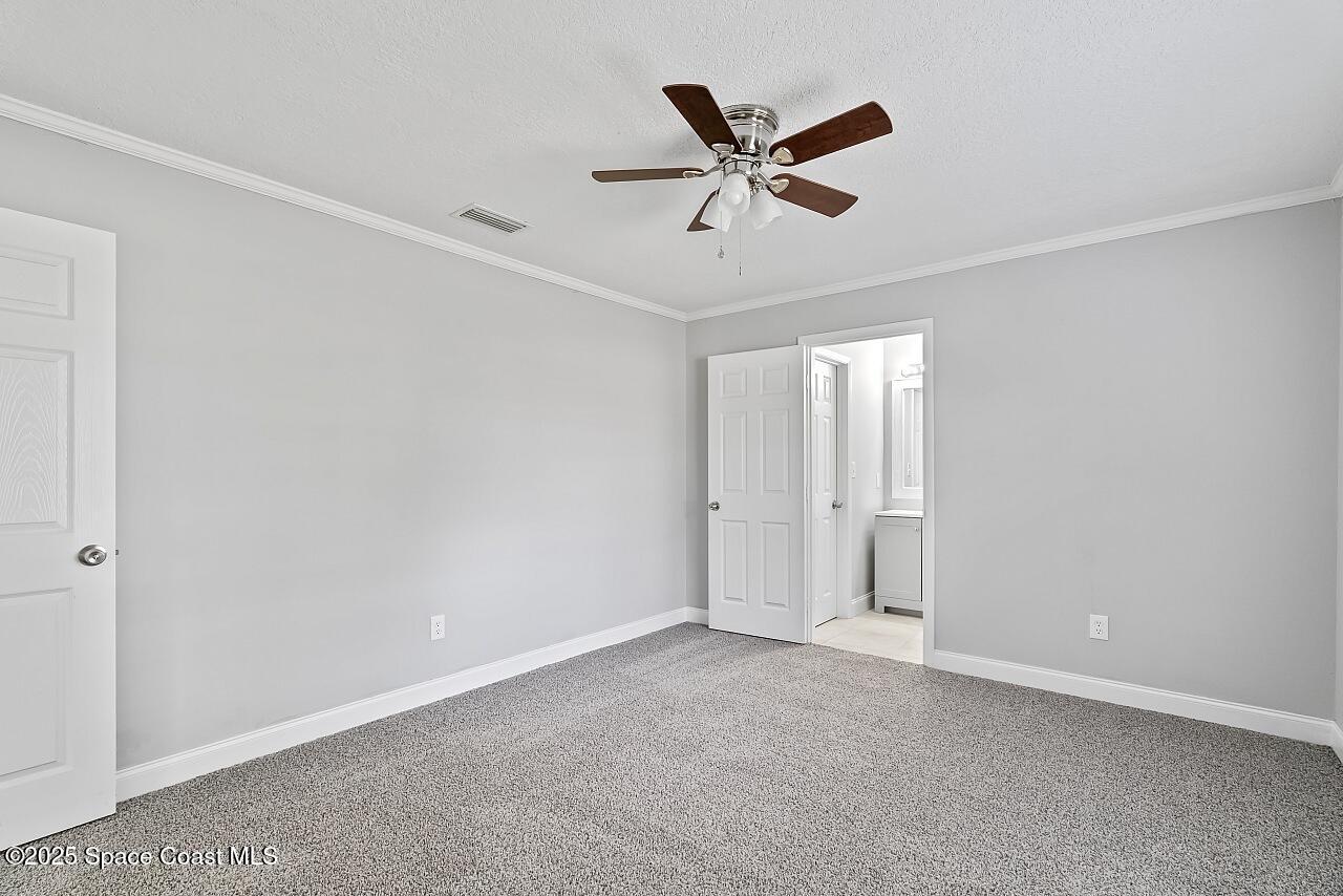 914 Devon Avenue Sebastian, FL 32958 - Photo 22 of 40 a view of a big room with closet and wooden floor