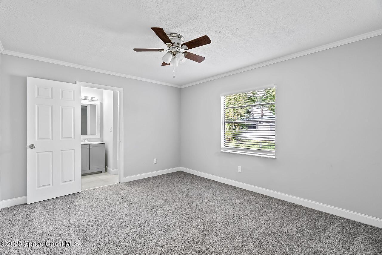 914 Devon Avenue Sebastian, FL 32958 - Photo 23 of 40 a view of a livingroom with a ceiling fan and window