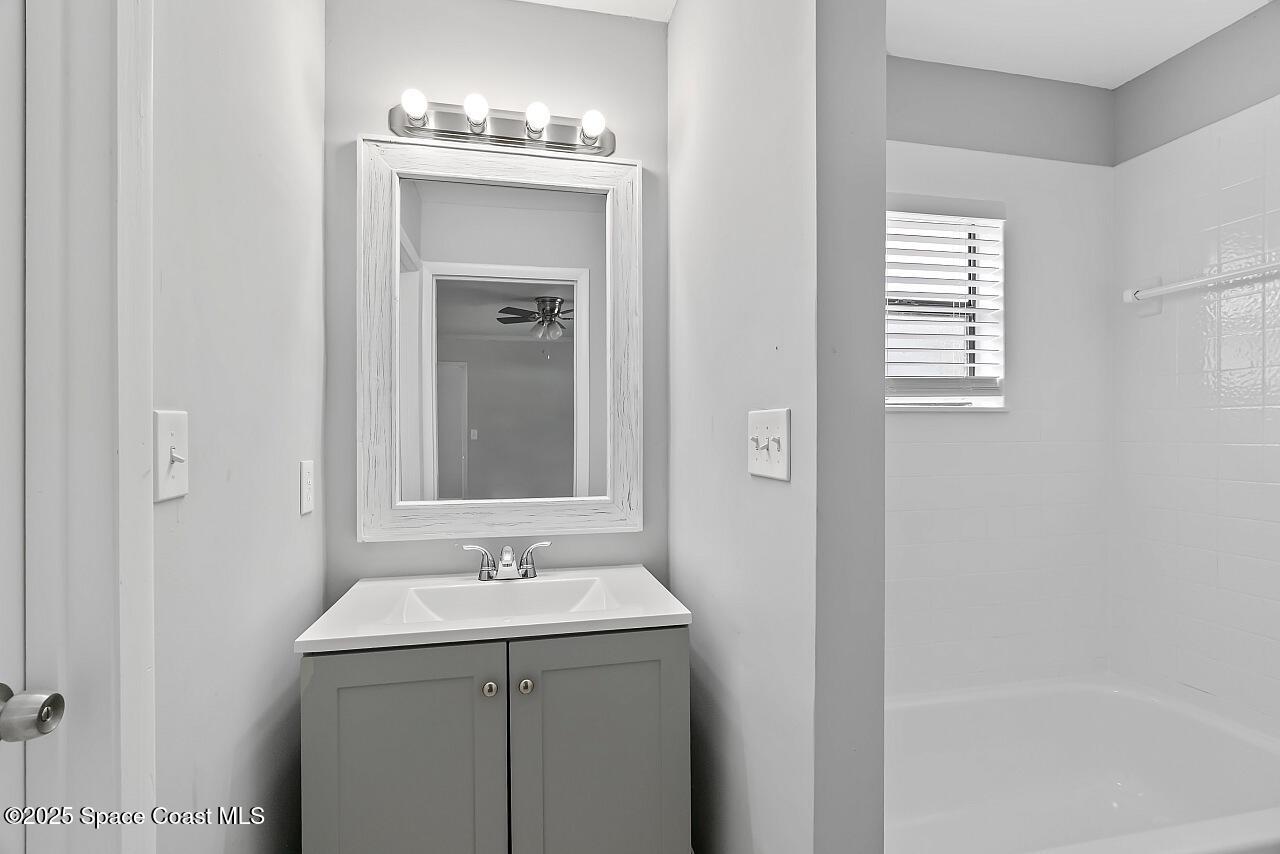 914 Devon Avenue Sebastian, FL 32958 - Photo 25 of 40 a bathroom with a sink and a mirror