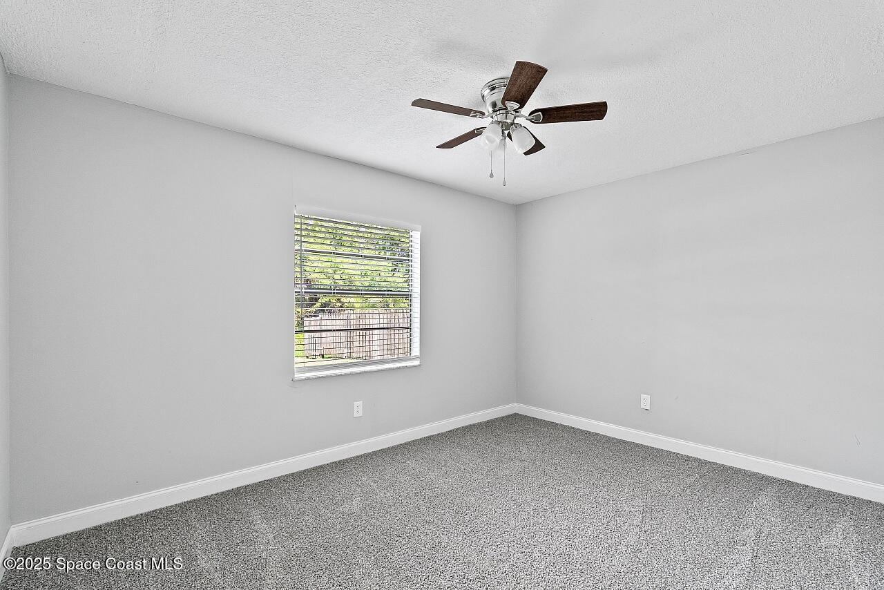 914 Devon Avenue Sebastian, FL 32958 - Photo 28 of 40 a view of a big room with wooden floor closet and windows