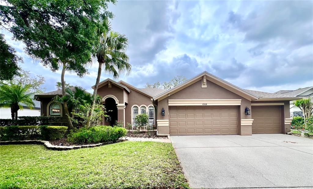 5968 Jaegerglen Drive Lithia, FL 33547 - Photo 1 of 1 a front view of a house with a yard and garage