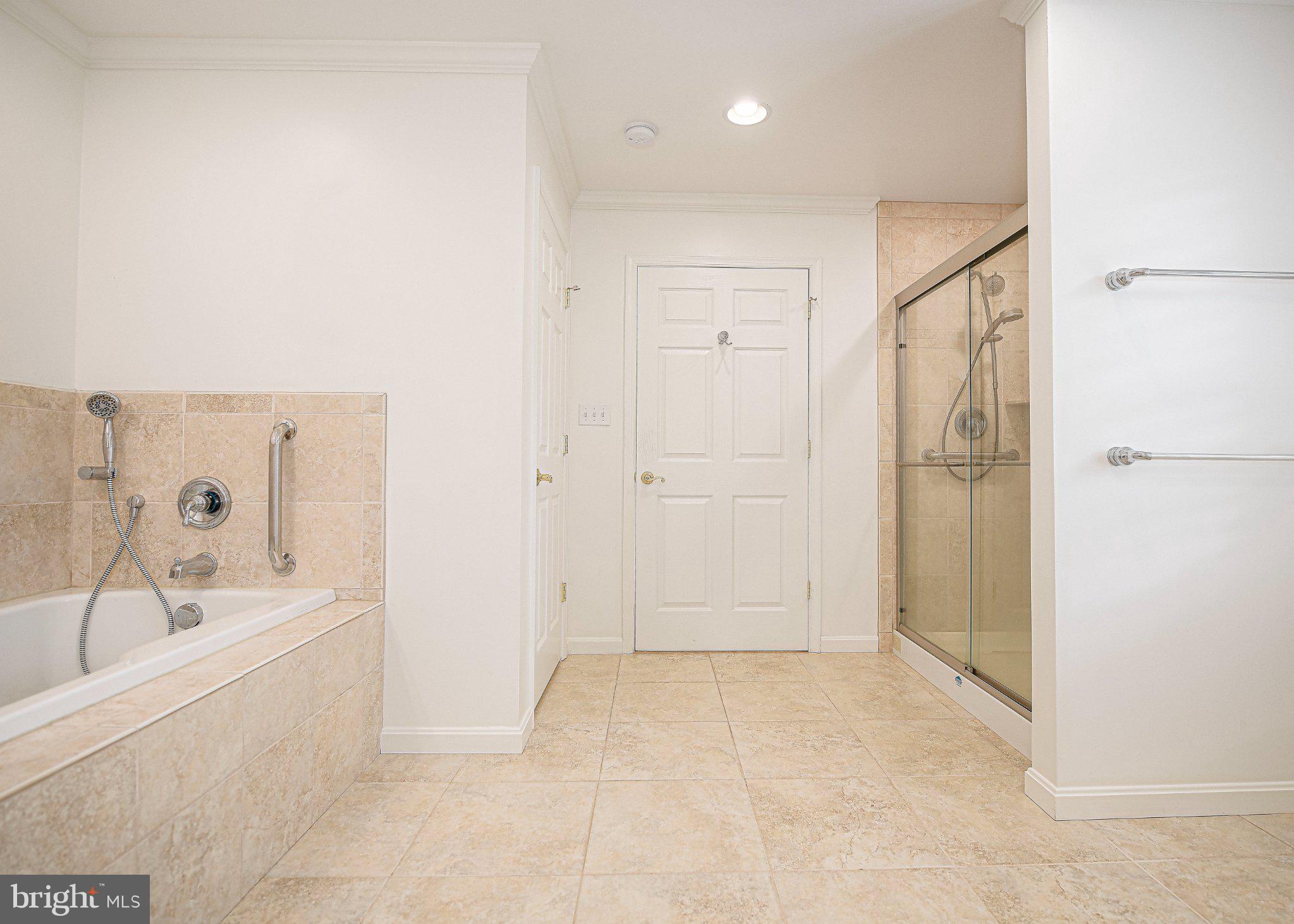 14300 Carroll Ridge Court Baldwin, MD 21013 - Photo 24 of 73 a bathroom with a bathtub and a shower