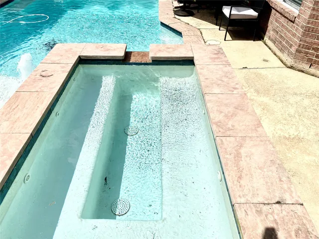 a view of swimming pool with a yard