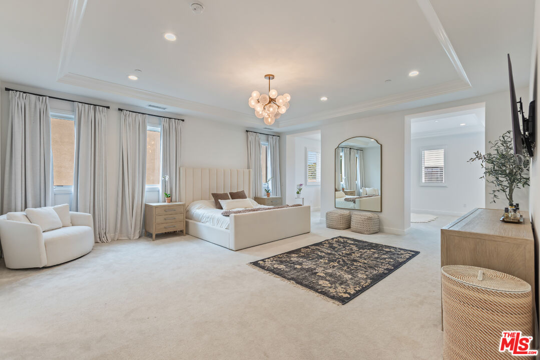 11734 Manchester Way Porter Ranch, CA 91326 - Photo 15 of 35 a living room with furniture and a couch