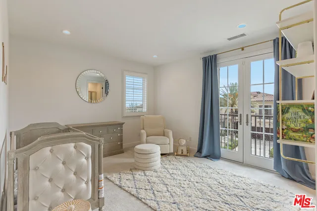 a spacious bathroom with a toilet sink and shower
