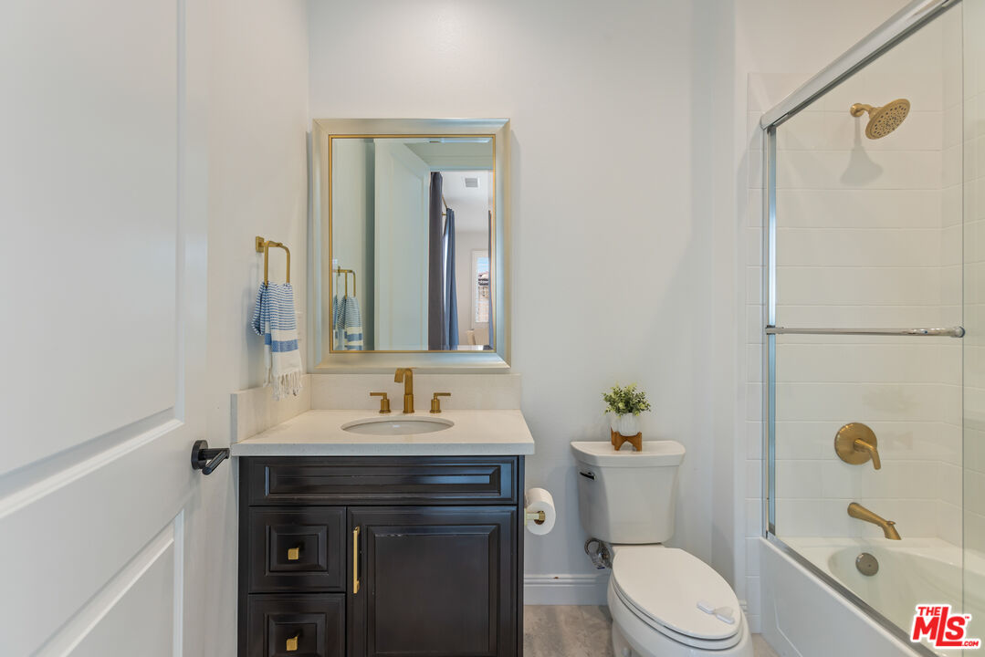 11734 Manchester Way Porter Ranch, CA 91326 - Photo 21 of 35 a bathroom with a sink a toilet and shower
